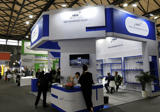 XIRO exhibition stand displaying servo press equipment and company profile